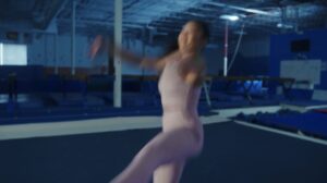 Suni Lee jumps and rotates in the gym while practicing as part of Crocs latest influencer marketing campaign. Captured by Unconquered content agency.