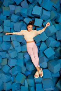 Suni Lee, Olympic Gold Medalist and gymnast works with Crocs as part of an NIL agreement in a Crocs influencer marketing campaign.