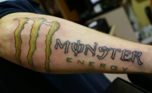 A picture of a Monster Energy tattoo from one of their loyal fans who have helped drive growth for the brand.