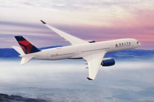 A Delta airplane in the sky. Delta recently enraged fans and customers with updates to their loyalty program.